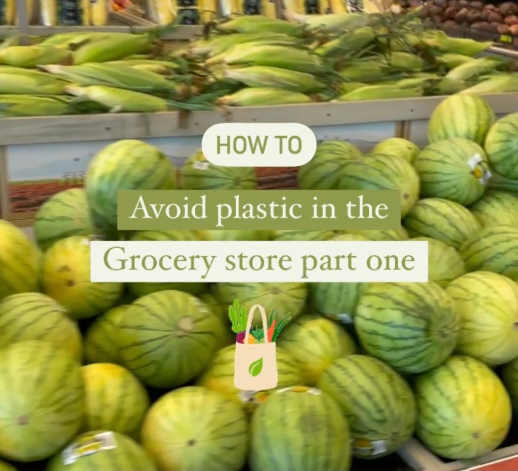 A stack of water melons at the grocery store, with green and white text blocked out over it, saying, how to avoid plastic in the grocery store part one. A small illustration of a grocery bag with vegetables sticking out  is below the text.